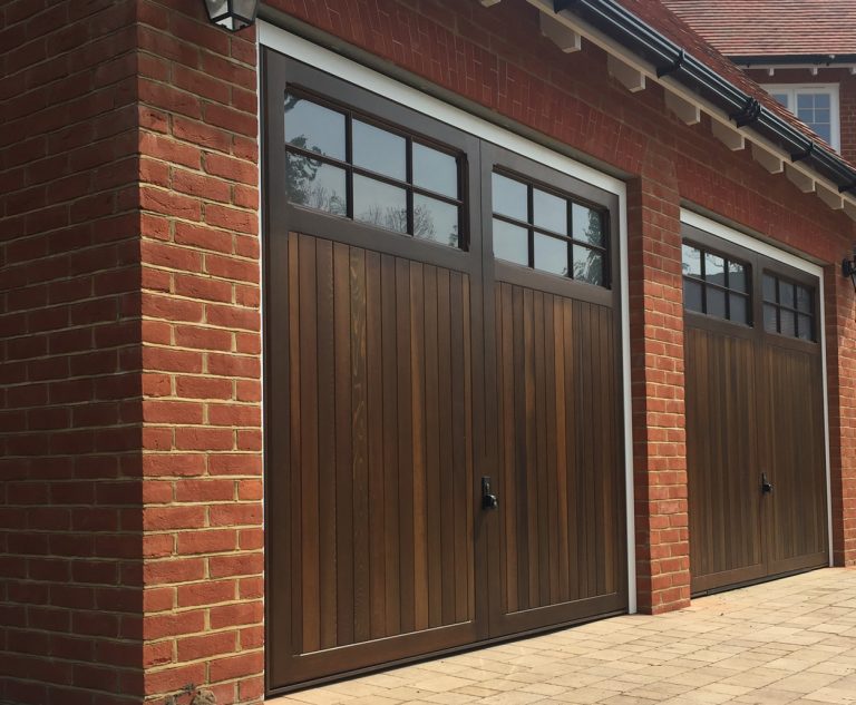timbergaragedoorwithwindows East Anglia Garage Doors Ltd.